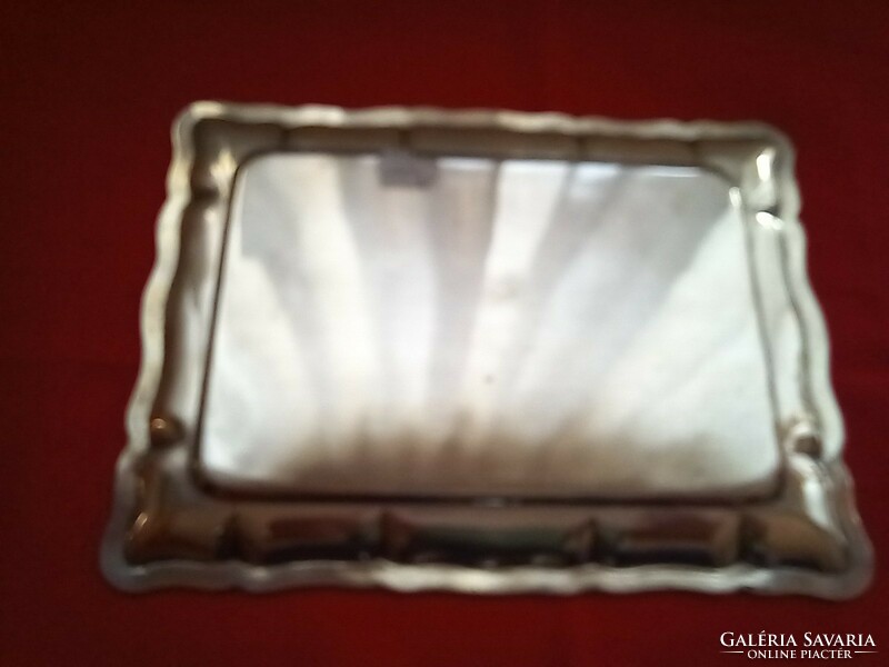 Silver tray with molded border. Diana is a marked citizen with a master's degree in Kalman