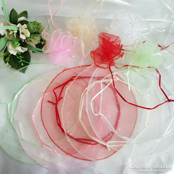 New, circular, shiny green organza decorative bag, gift bag