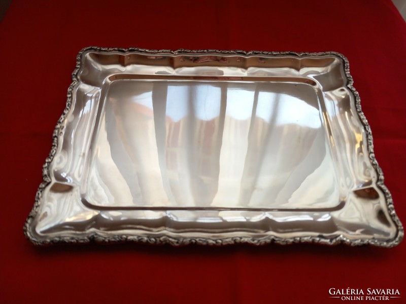 Silver tray with molded border. Diana is a marked citizen with a master's degree in Kalman