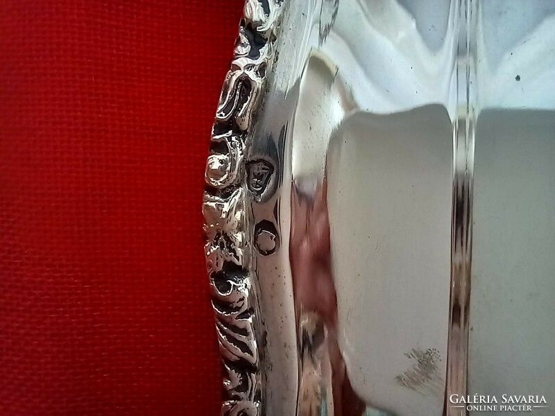 Silver tray with molded border. Diana is a marked citizen with a master's degree in Kalman