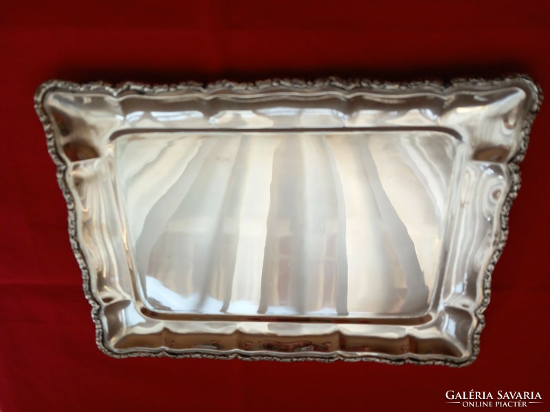 Silver tray with molded border. Diana is a marked citizen with a master's degree in Kalman