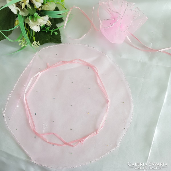 New, circular, shiny pink organza decorative bag, gift bag