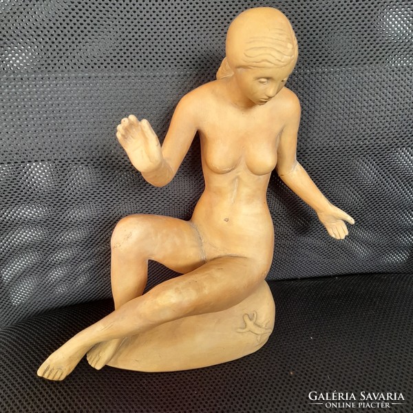 Spherical László nude terracotta statue