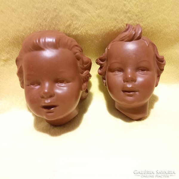 2 pairs of boy-girl heads. By w. Goebel (1957). Wall decoration, figural sculpture.