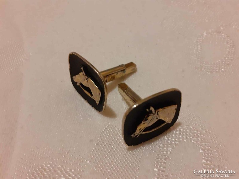 Cufflink decorated with horse head