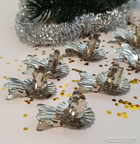 A package of old candle clips for a Christmas tree in new condition