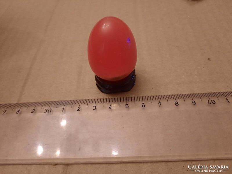 Carnelian mineral egg on a wooden base, negotiable