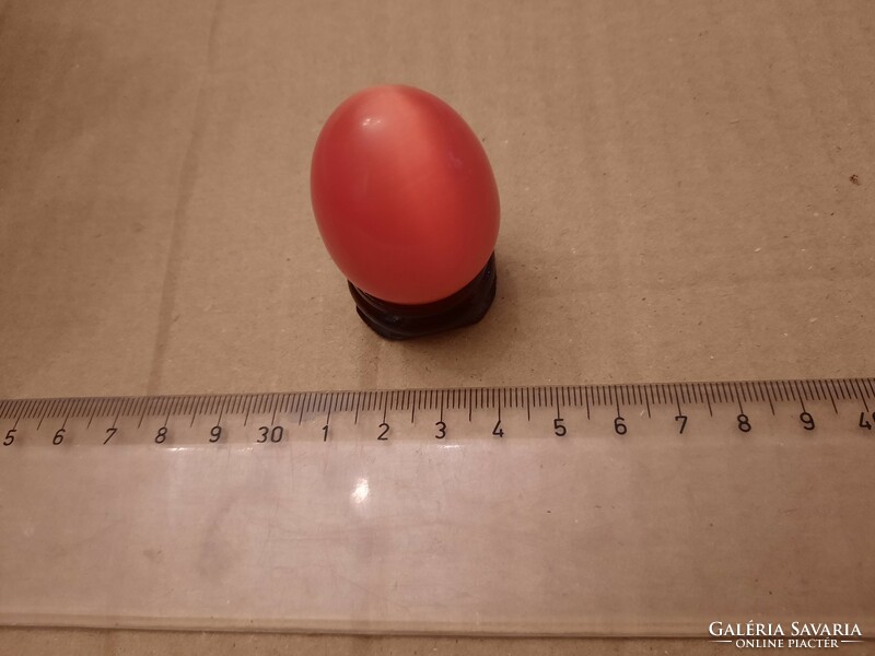 Carnelian mineral egg on a wooden base, negotiable
