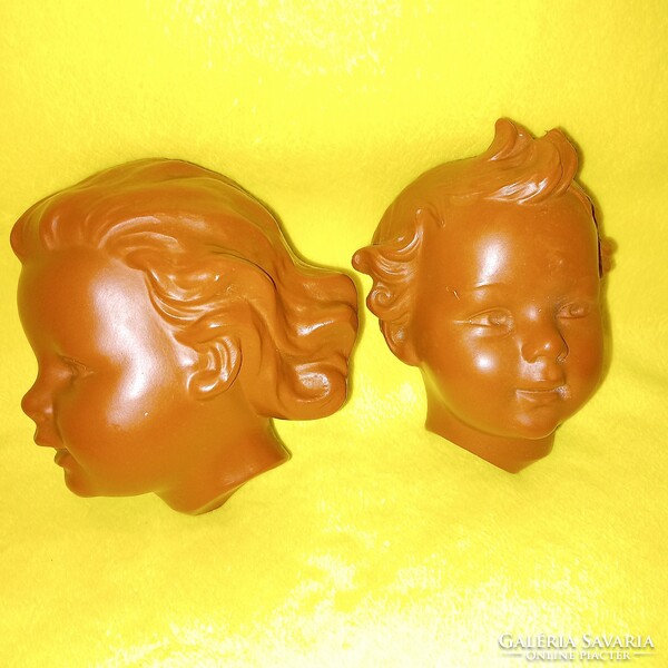 2 pairs of boy-girl heads. By w. Goebel (1957). Wall decoration, figural sculpture.