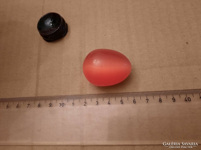 Carnelian mineral egg on a wooden base, negotiable