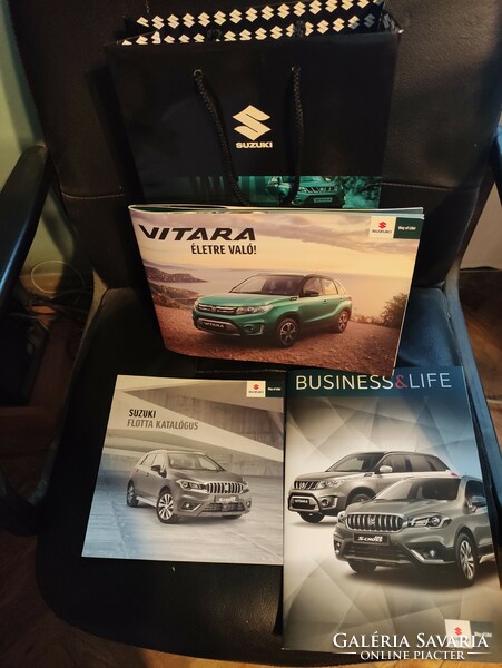 Suzuki car catalogs + advertising bag in one.