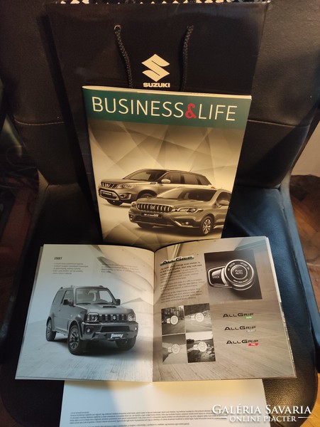 Suzuki car catalogs + advertising bag in one.