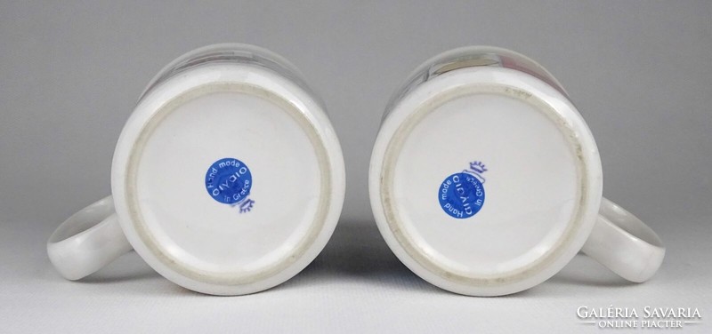 Pair of Greek porcelain mugs marked 1Q031