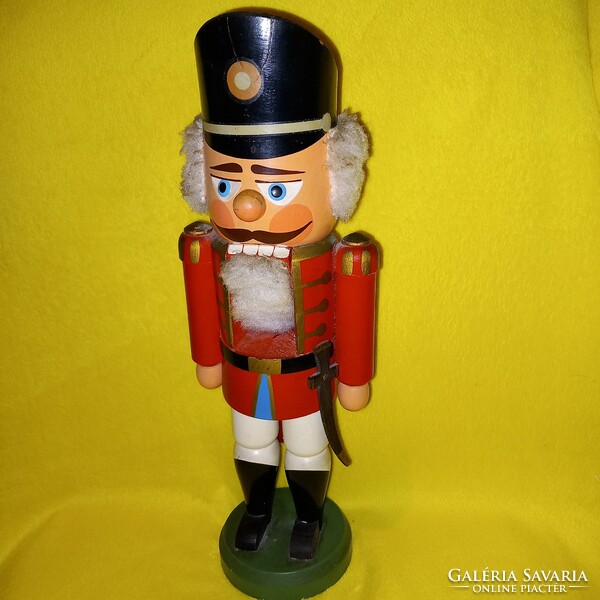 Old marked nutcracker soldier, Christmas decoration, wooden figure, statue.
