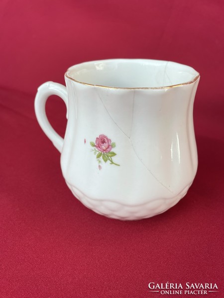 Zsolnay's small rose-brimmed mug is defective