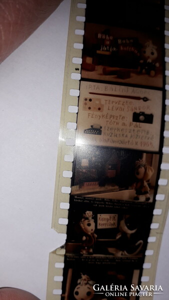 Old colorful fairy tale slide film böbe doll in the toy store according to the pictures