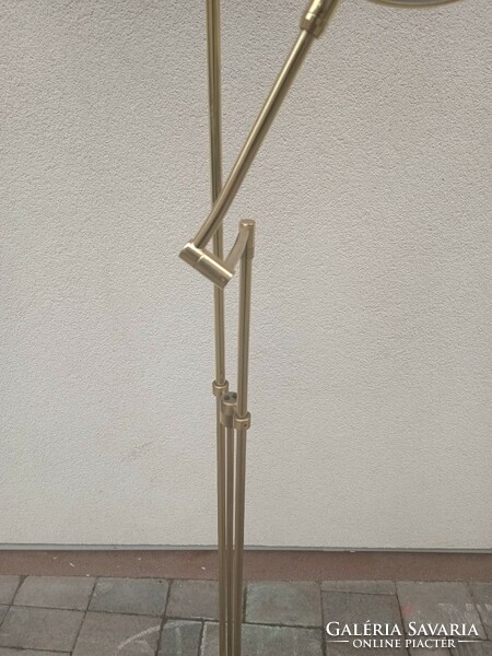 Modern design floor lamp with adjustable arm. Negotiable.