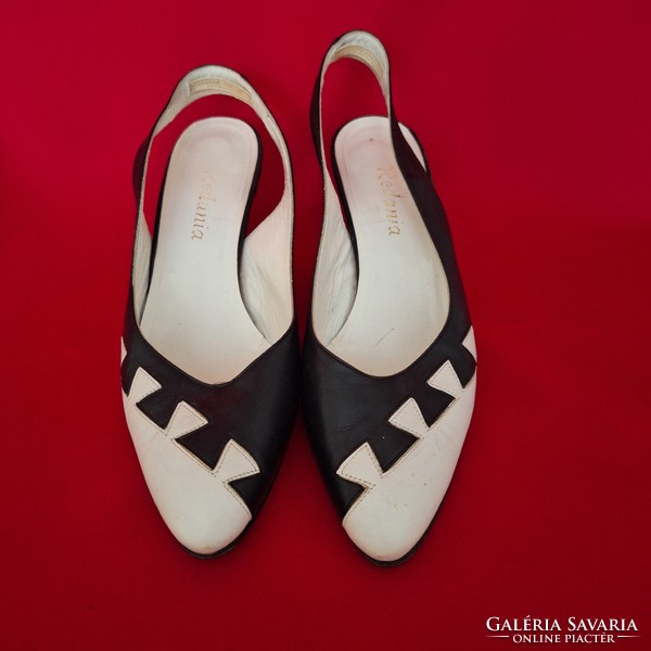 Vintage, Italian black and white women's leather shoes with straps at the back.