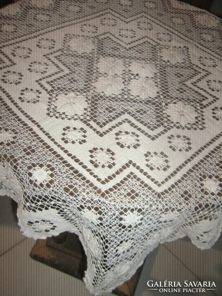 Cream-colored needlework lace tablecloth made in a beautiful art nouveau style