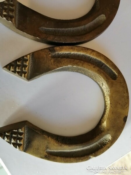 Two small copper horseshoes found in the attic