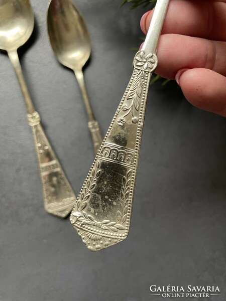 Beautifully patterned nickel silver spoons together