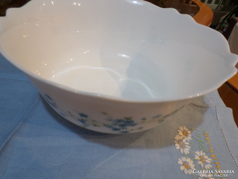 Milk glass bowl with a Jena face in a circle with a flower pattern
