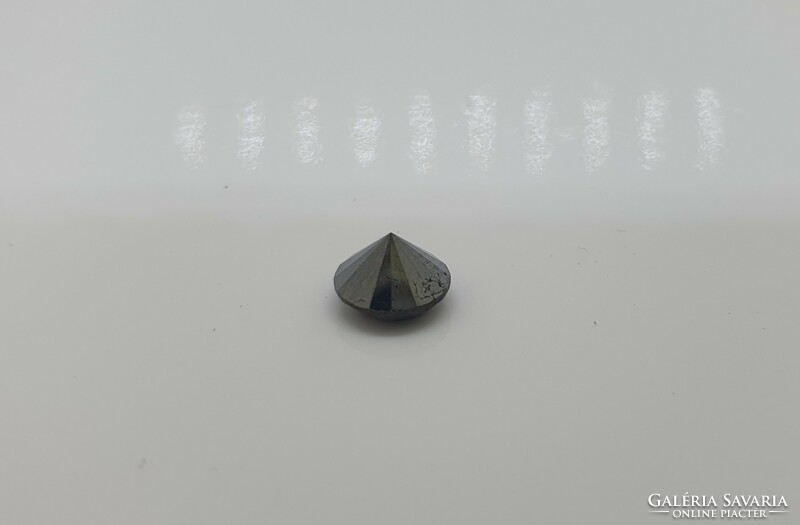 Diamond coated 1.46 carat brill cut moisanite.