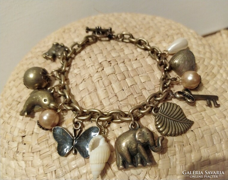 Showy vintage bracelet with many pendants