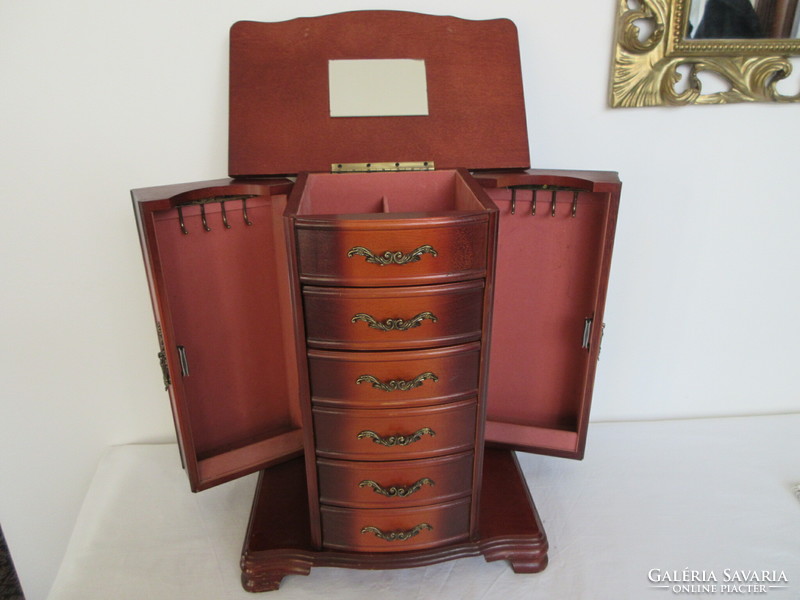 Old, solid wood, huge jewelery storage cabinet. Negotiable!.