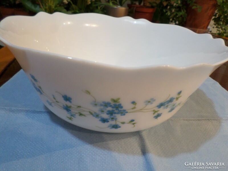 Milk glass bowl with a Jena face in a circle with a flower pattern