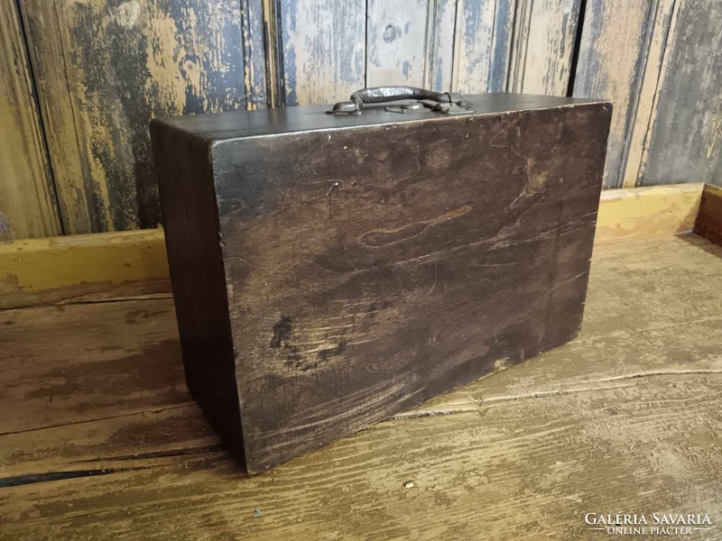 Wooden travel suitcase, brown vintage travel chest, suitcase from the first half of the 20th century, treated, cleaned