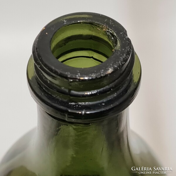 Olive green rum bottle with label 