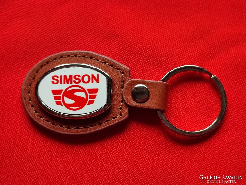 Simson oval metal key ring on a leather base