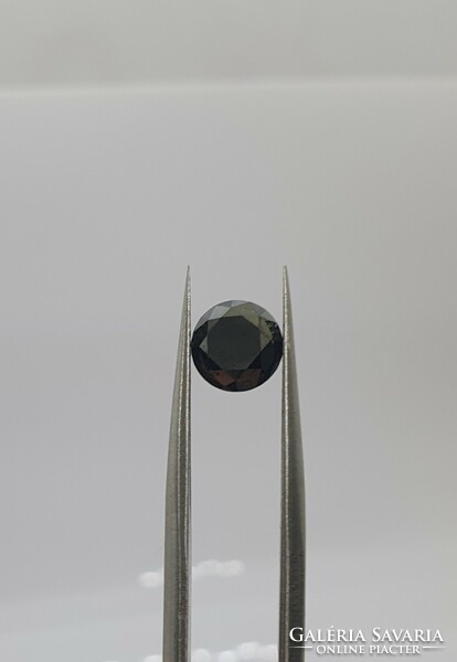 Diamond coated 1.46 carat brill cut moisanite.