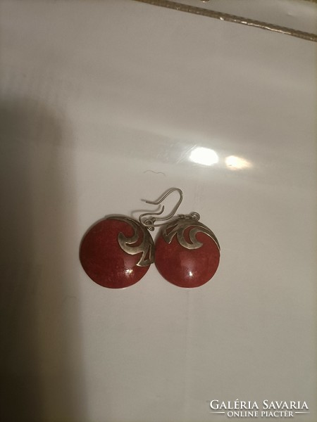 Silver earrings with a red stone
