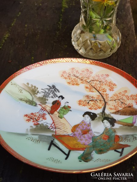 Oriental geisha eggshell porcelain cup and saucer