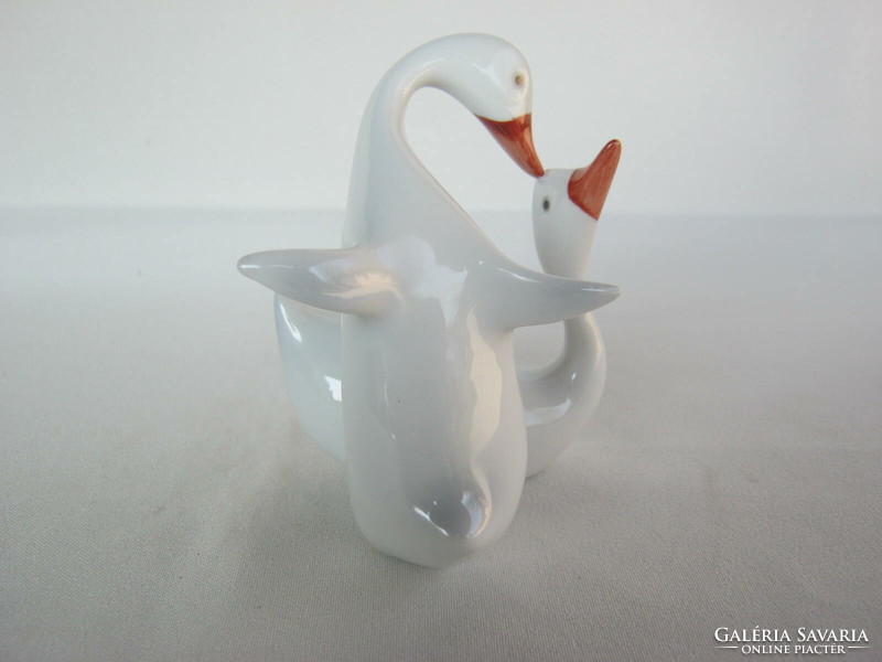 Couple of raven porcelain geese