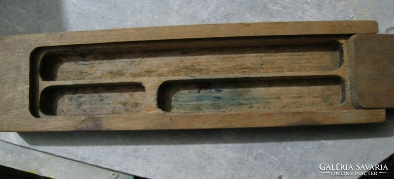 Old wooden pen holder with sliding lid