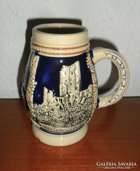 Beer mug with German embossed pattern. 11 cm high.