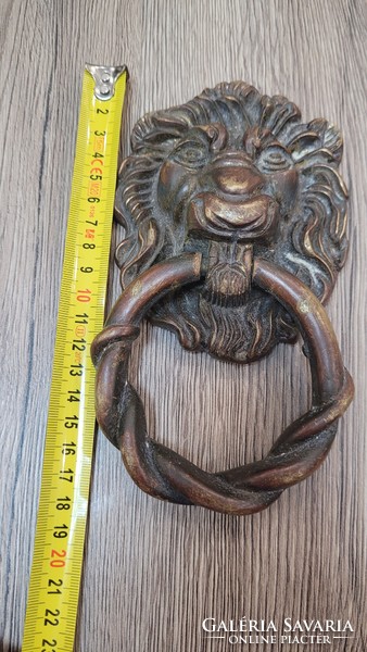 Antique copper lion head door knocker.