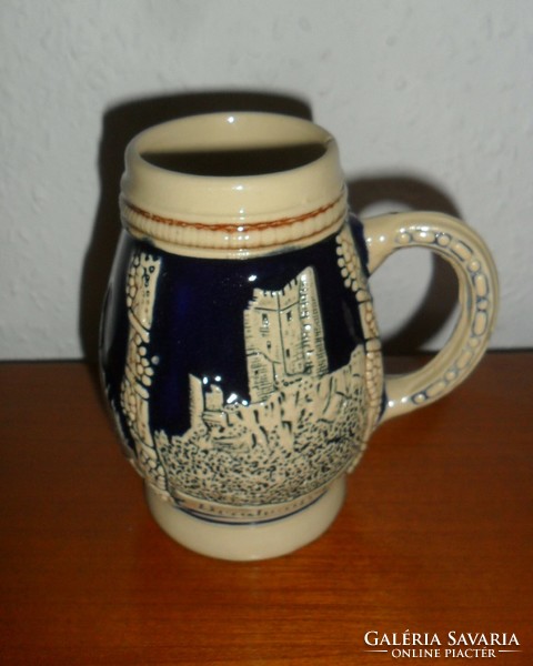 Beer mug with German embossed pattern. 11 cm high.