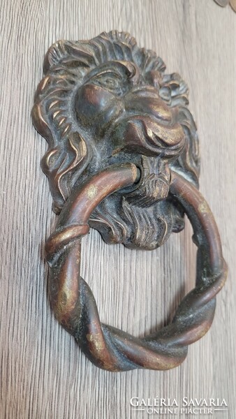 Antique copper lion head door knocker.