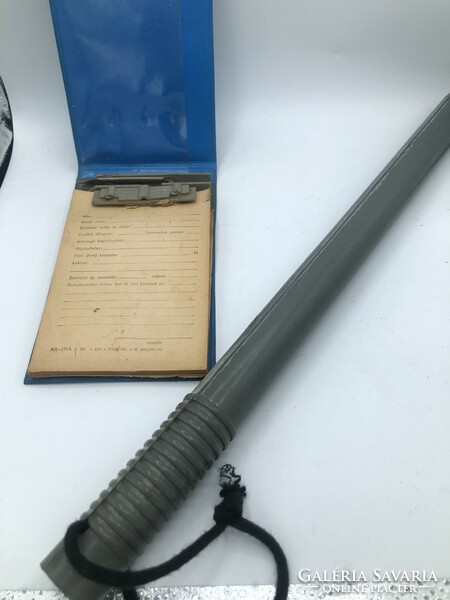 Old police rubber baton and writing pad