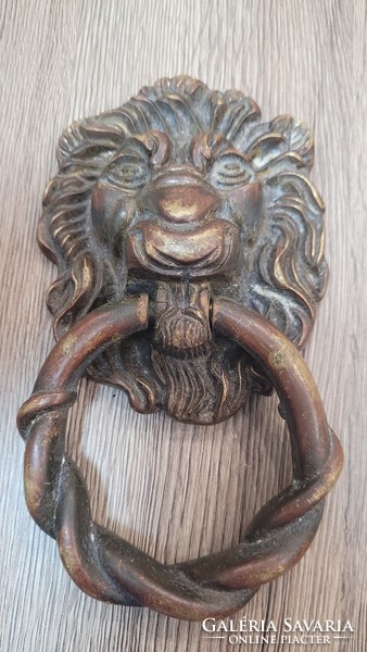 Antique copper lion head door knocker.