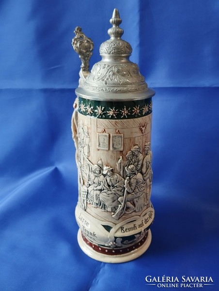 A large hunter jar with a tin lid and a plastic bulge