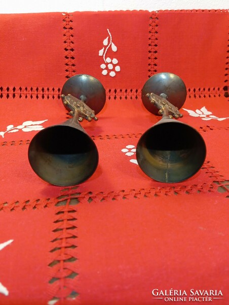 A pair of retro copper candle holders with the coat of arms of Budapest