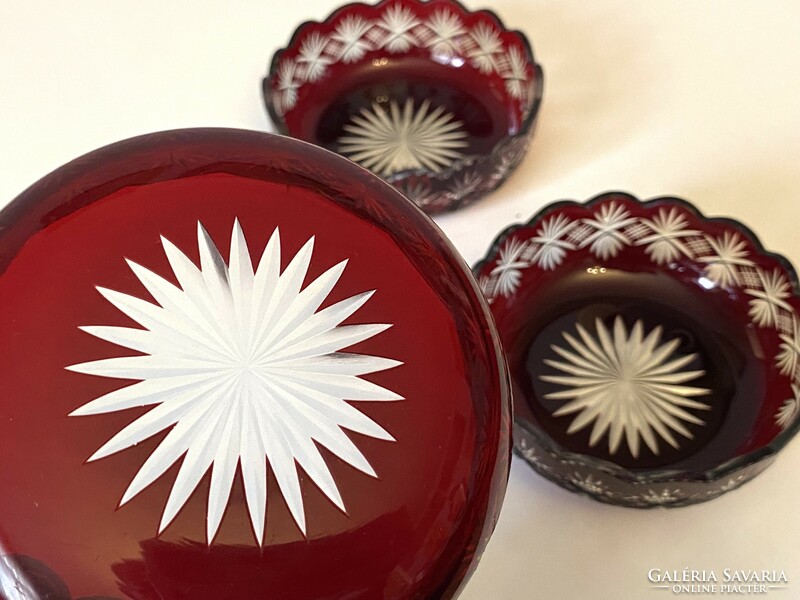 3 burgundy-colored incised crystal serving bowls with candied hazelnuts