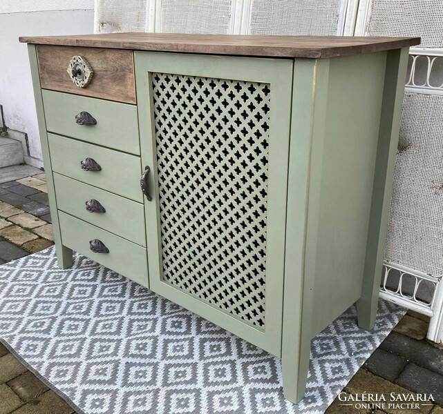 Chest of drawers with an oriental feel, antiqued with gold, with cast iron handles...