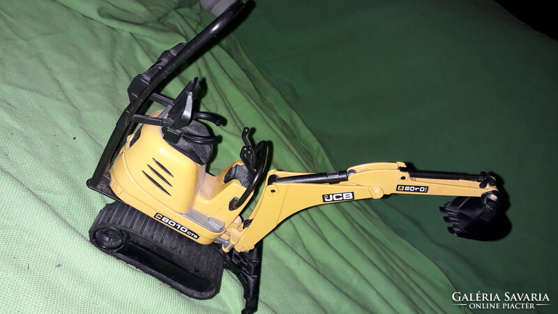 German bruder mini muna machine excavator in very nice condition, micro -jcb 8010 20 x 18 cm as shown in the pictures