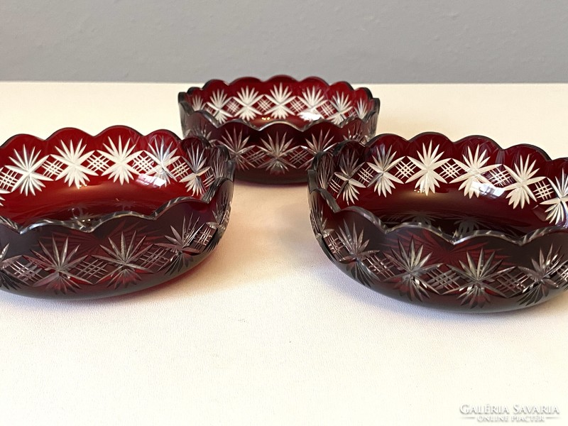 3 burgundy-colored incised crystal serving bowls with candied hazelnuts